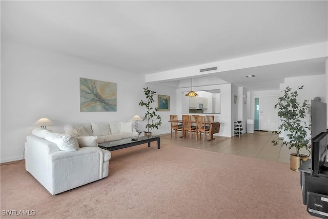 living room with tile patterned floors