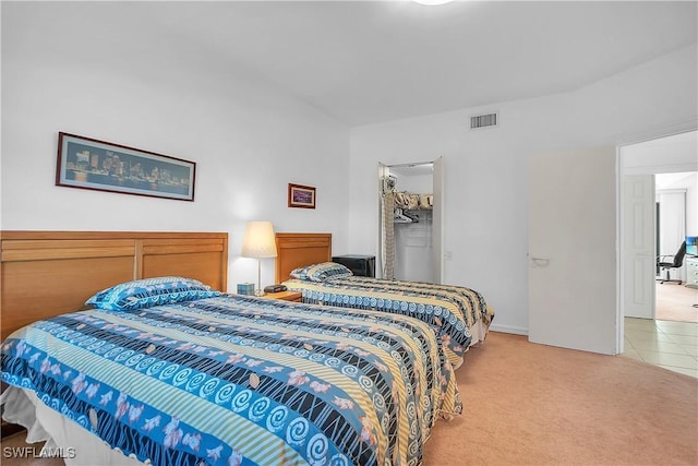 carpeted bedroom with a closet