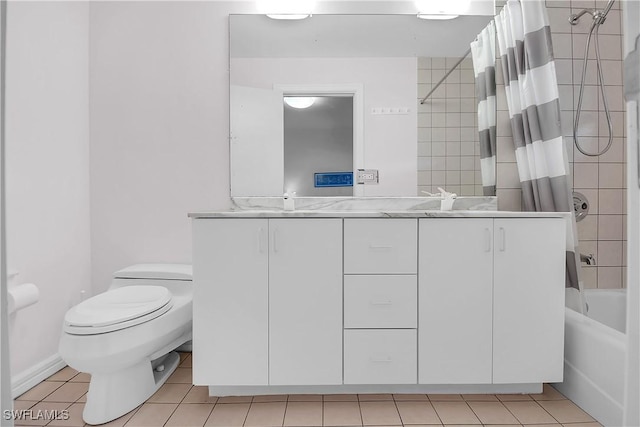 full bathroom with tile patterned floors, shower / tub combo with curtain, vanity, and toilet