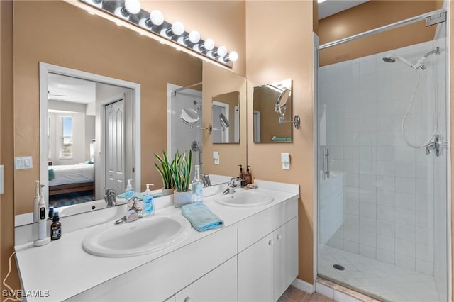 bathroom featuring walk in shower and vanity