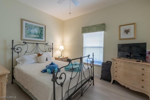 bedroom featuring ceiling fan and multiple windows