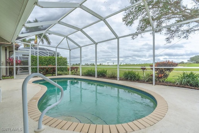 view of pool featuring a patio area and a lanai