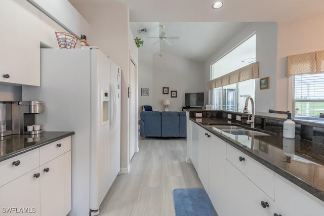 kitchen featuring light wood-type flooring, ceiling fan, sink, white cabinets, and white fridge with ice dispenser