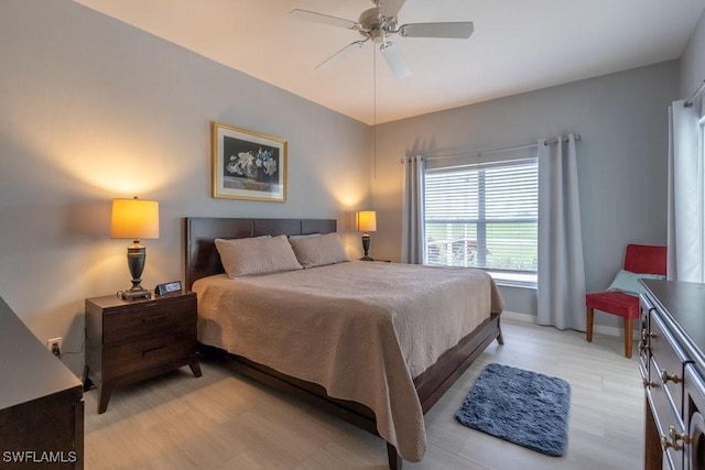 bedroom featuring light wood-type flooring and ceiling fan