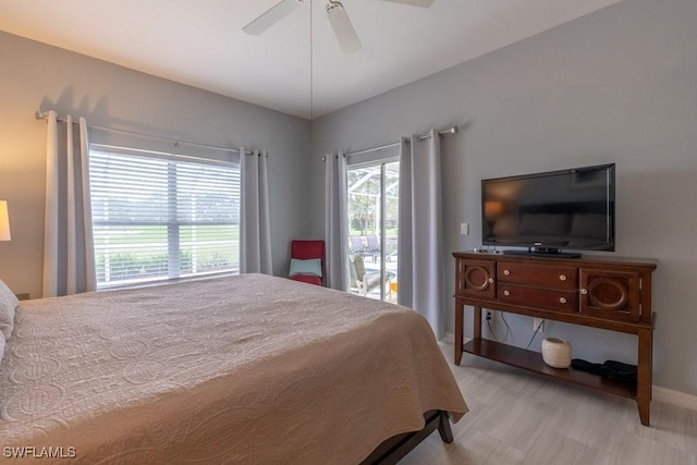 bedroom with access to outside, ceiling fan, and light hardwood / wood-style floors