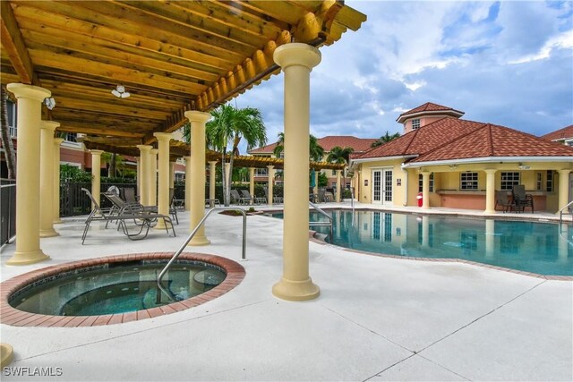 view of pool with a pergola, a patio area, and a community hot tub