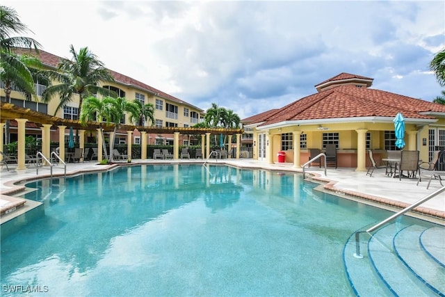 view of swimming pool with a patio area