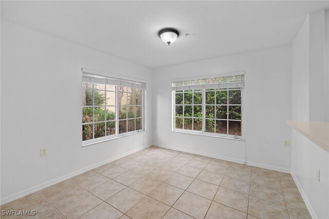 empty room featuring light tile patterned floors