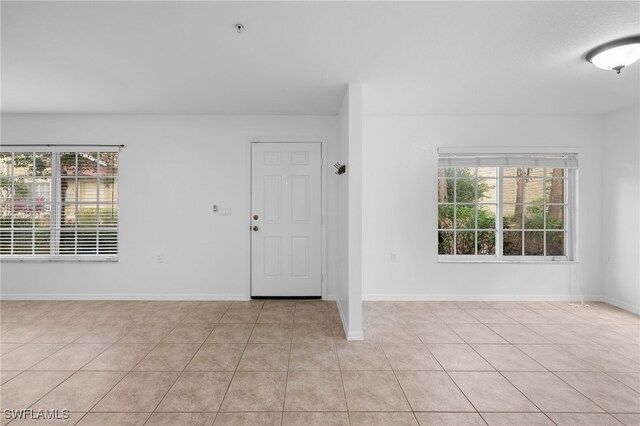 entryway featuring light tile patterned floors