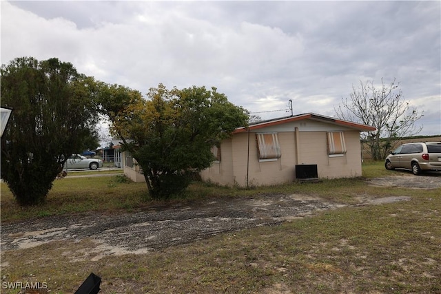 view of home's exterior with cooling unit