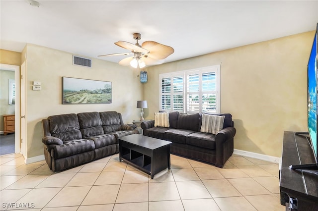 tiled living room featuring ceiling fan