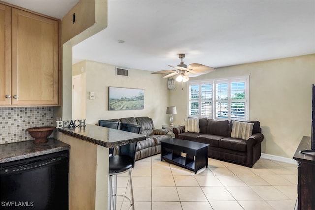 living room featuring light tile patterned floors and ceiling fan