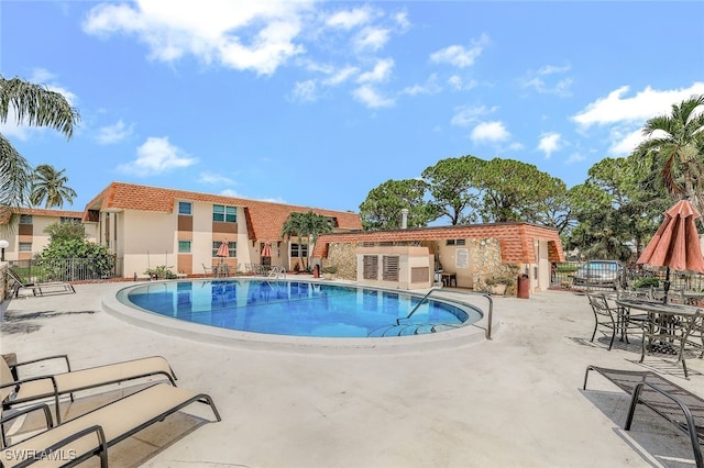 view of pool featuring a patio area