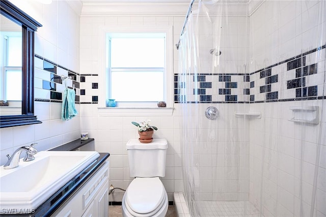 bathroom with a shower with curtain, vanity, toilet, and tile walls