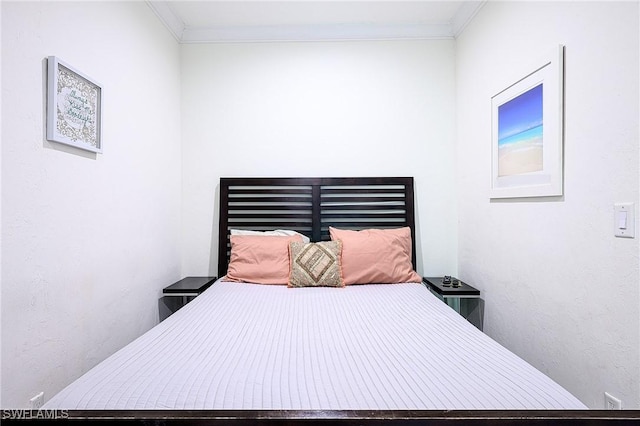 bedroom with ornamental molding