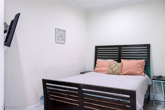 bedroom with ornamental molding