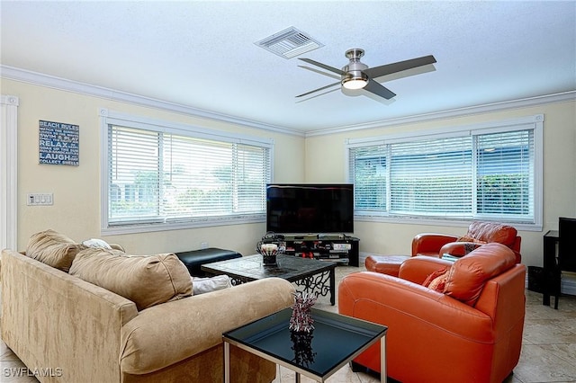 tiled living room with ceiling fan and ornamental molding