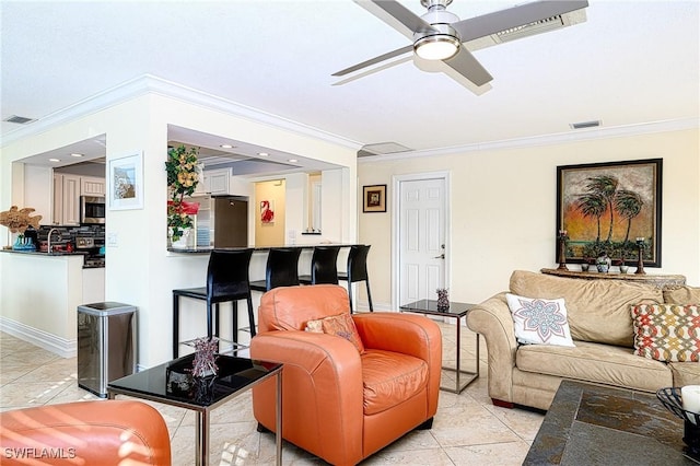 living room with ceiling fan, light tile patterned floors, and ornamental molding