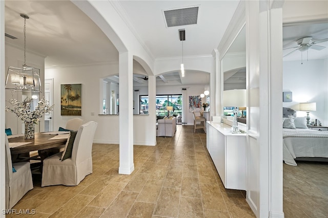 interior space featuring ceiling fan with notable chandelier and ornamental molding