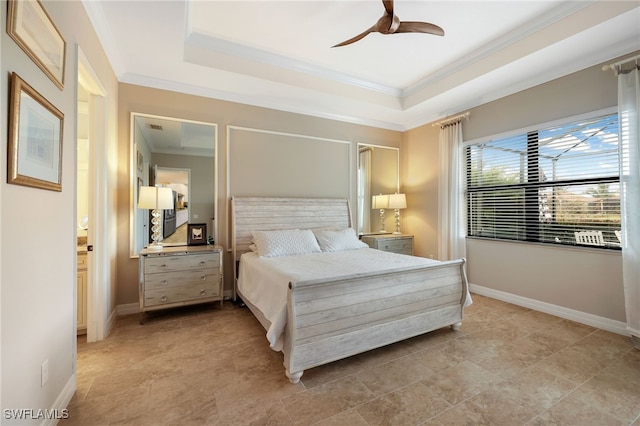 bedroom featuring a raised ceiling, ceiling fan, and crown molding