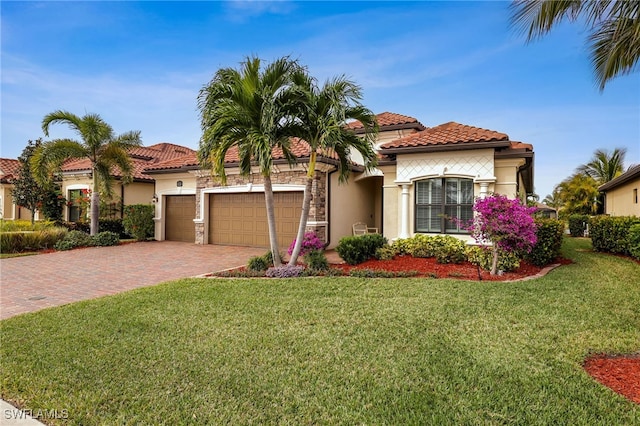 mediterranean / spanish home with a front yard