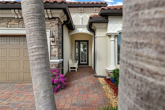 doorway to property featuring a garage