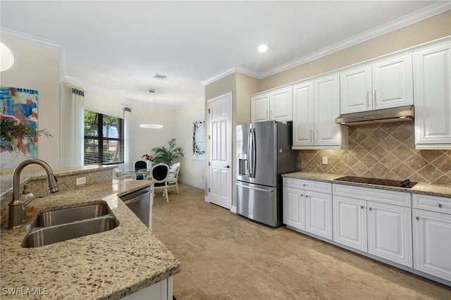 kitchen featuring appliances with stainless steel finishes, decorative light fixtures, white cabinetry, and sink