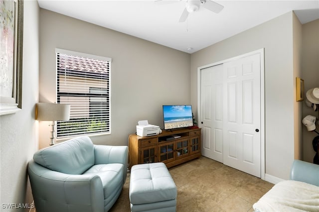 living room featuring ceiling fan