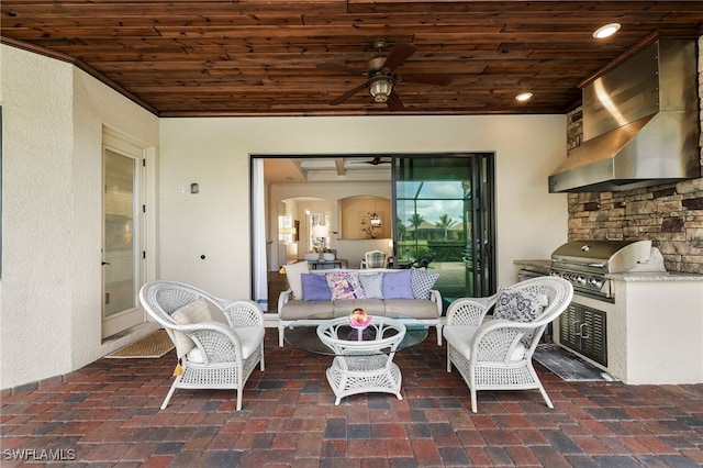 view of patio / terrace featuring outdoor lounge area, area for grilling, ceiling fan, and exterior kitchen