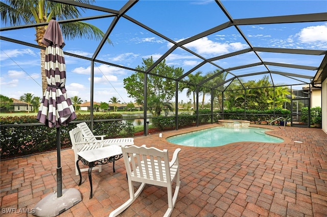 view of swimming pool with an in ground hot tub, a patio, a water view, and a lanai