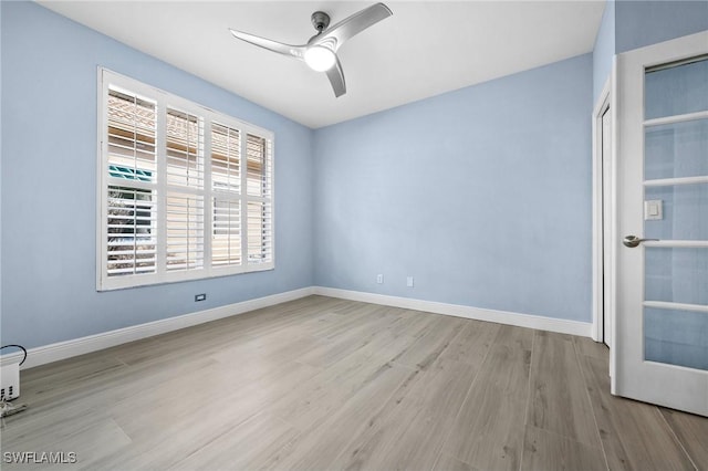 unfurnished room with ceiling fan and light hardwood / wood-style flooring