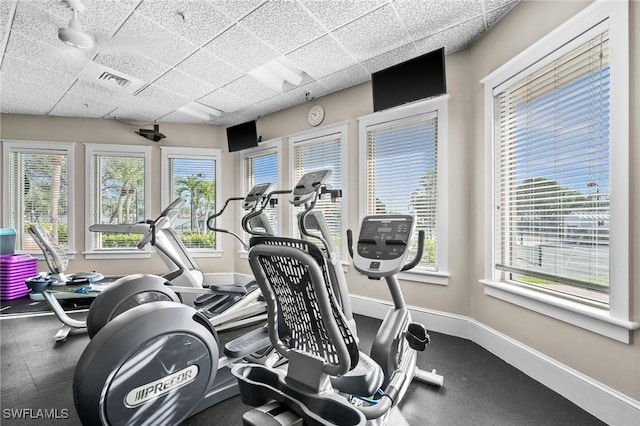 gym featuring a paneled ceiling