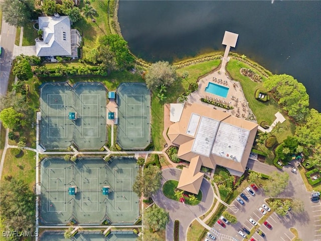 birds eye view of property with a water view