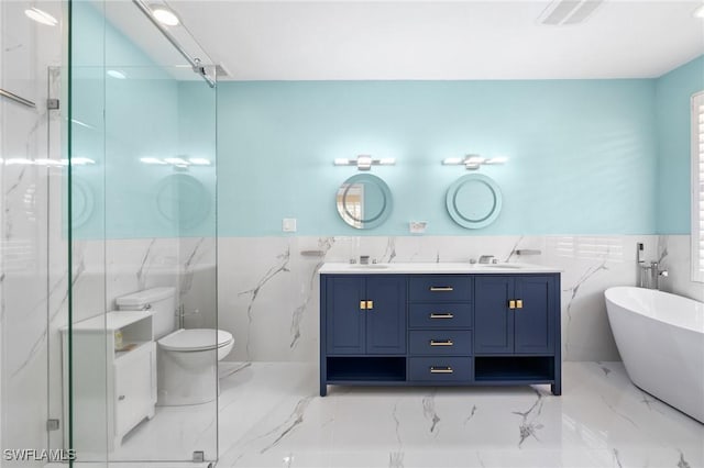 bathroom with a bathtub, toilet, tile walls, and vanity