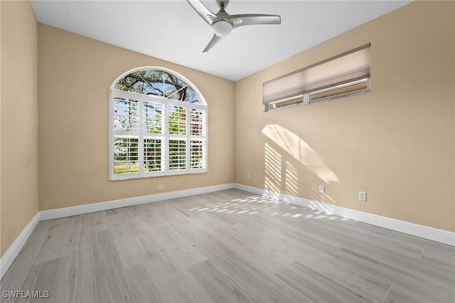 empty room with light wood-type flooring and ceiling fan