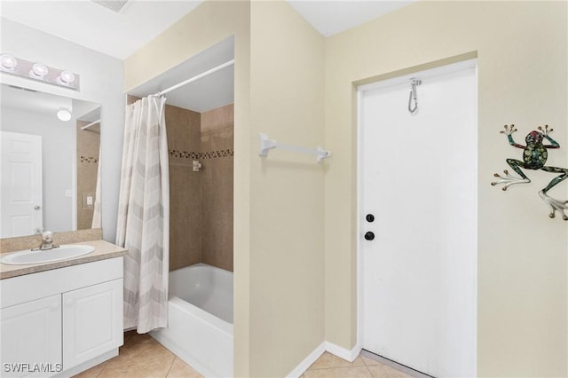 bathroom featuring tile patterned floors, vanity, and shower / bath combo