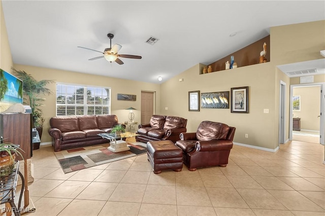 living room with ceiling fan, light tile patterned floors, and lofted ceiling