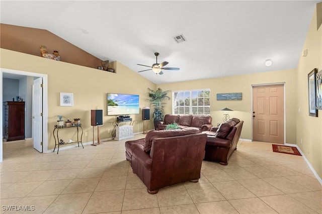 living room featuring ceiling fan, lofted ceiling, and light tile patterned flooring