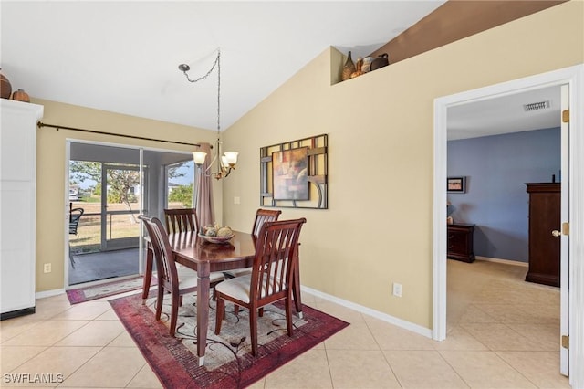 dining room featuring vaulted ceiling, a notable chandelier, and light tile patterned flooring