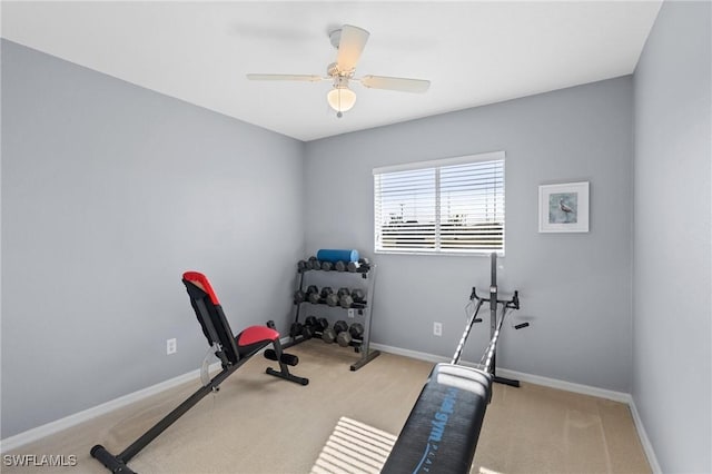 exercise area with light carpet and ceiling fan