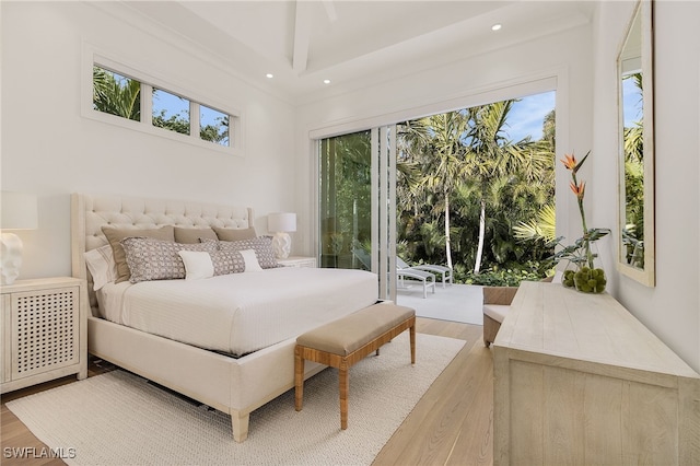 bedroom featuring hardwood / wood-style floors and access to exterior