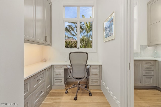 office with light hardwood / wood-style flooring