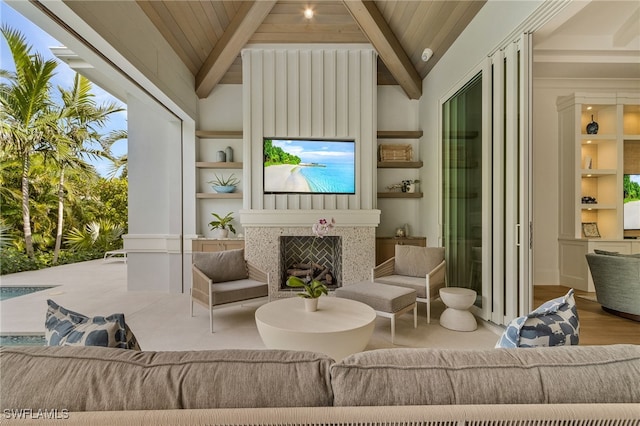 living room featuring vaulted ceiling with beams, light hardwood / wood-style floors, and wooden ceiling