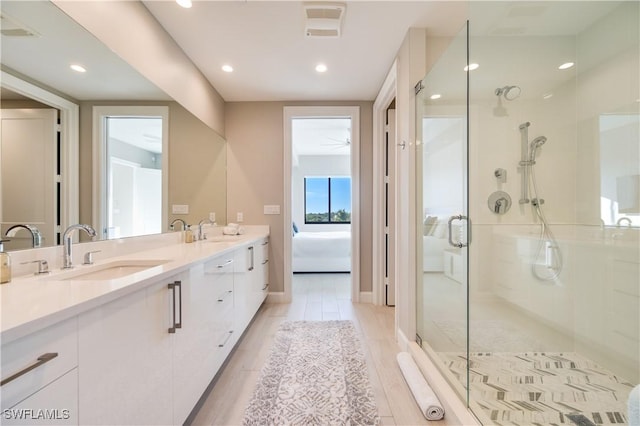 bathroom with vanity and an enclosed shower