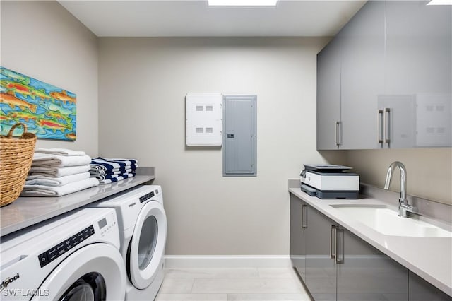 washroom with washing machine and clothes dryer, electric panel, sink, and cabinets