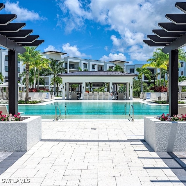 view of pool featuring a patio area and a pergola