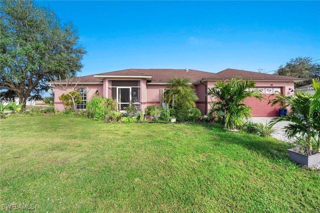 view of front facade with a front lawn and a garage