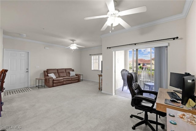 carpeted home office featuring ceiling fan and ornamental molding