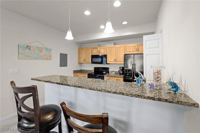 kitchen with hanging light fixtures, kitchen peninsula, light brown cabinetry, and black appliances