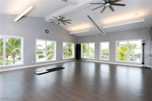 workout area with ceiling fan and vaulted ceiling